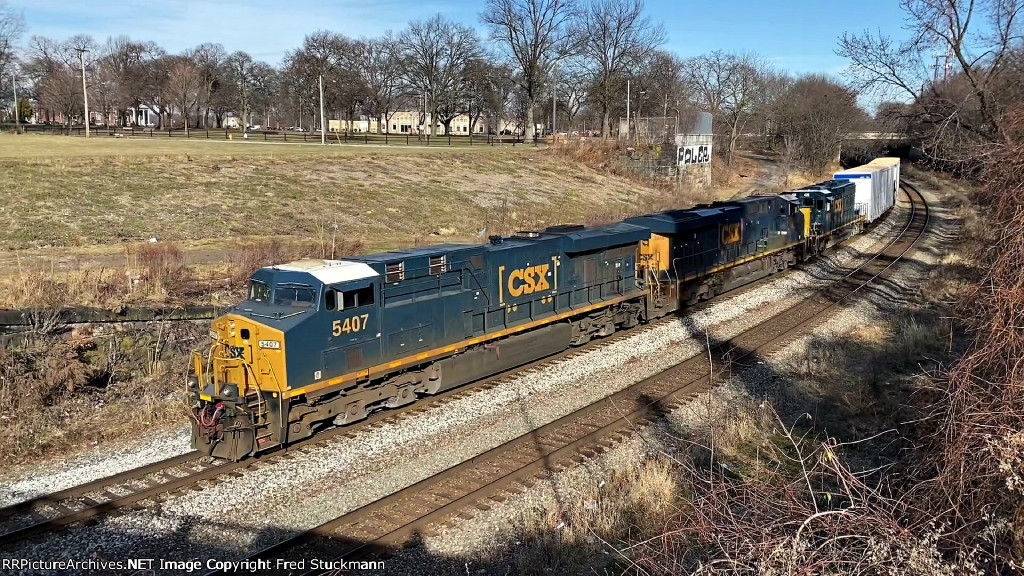 CSX 5407 leads D700 under E. Market St. Bridge.